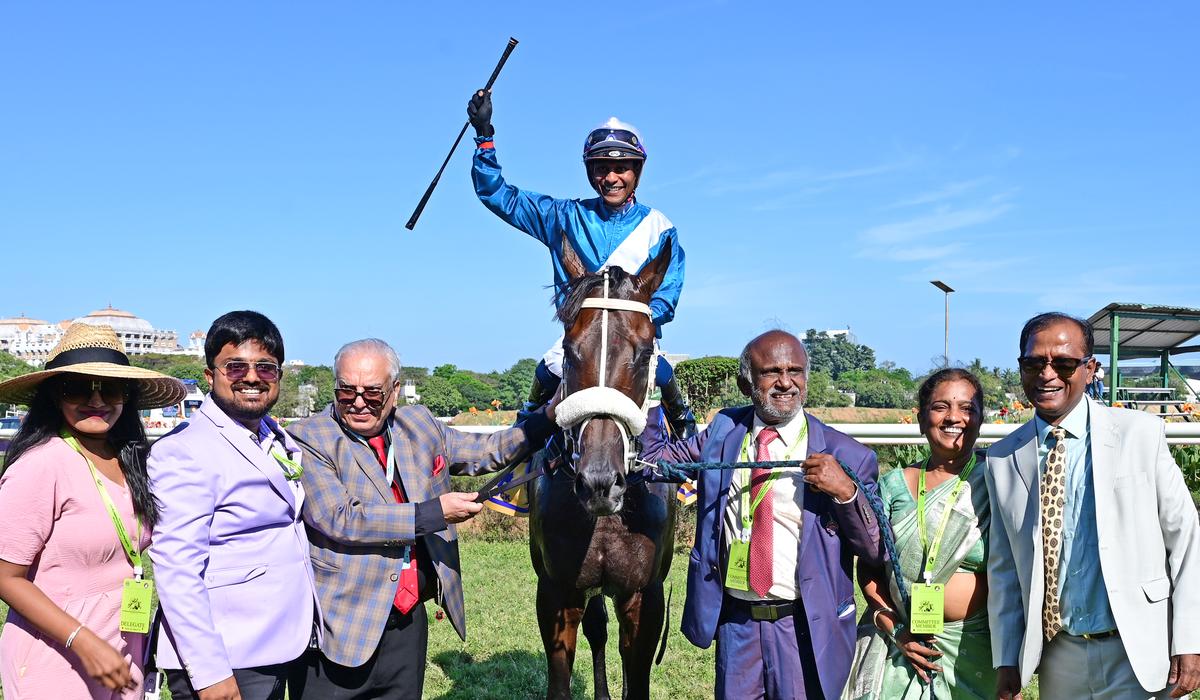 Owners M. Ravi and wife Chellam Ravi, Daulat Chhabria, third from left, trainer Satish Narredu, right, along with Sweta and Srinivasa leading in Shamrock (Suraj Narredu astride) after the success in the Maj. P.K. Mehra Memorial Super Mile Cup.